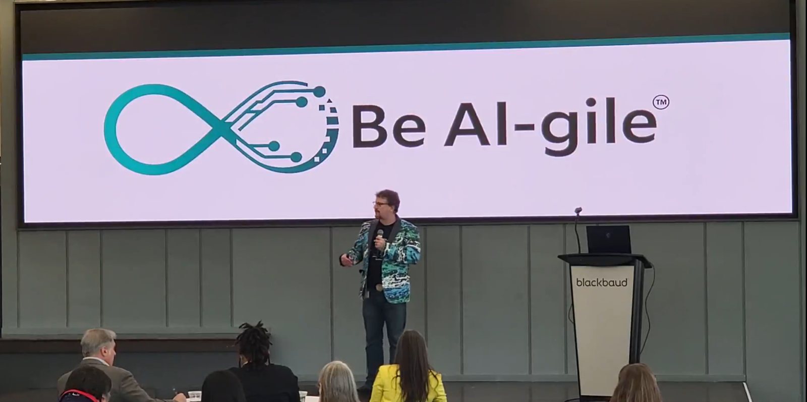 On stage, engaging with an audience
